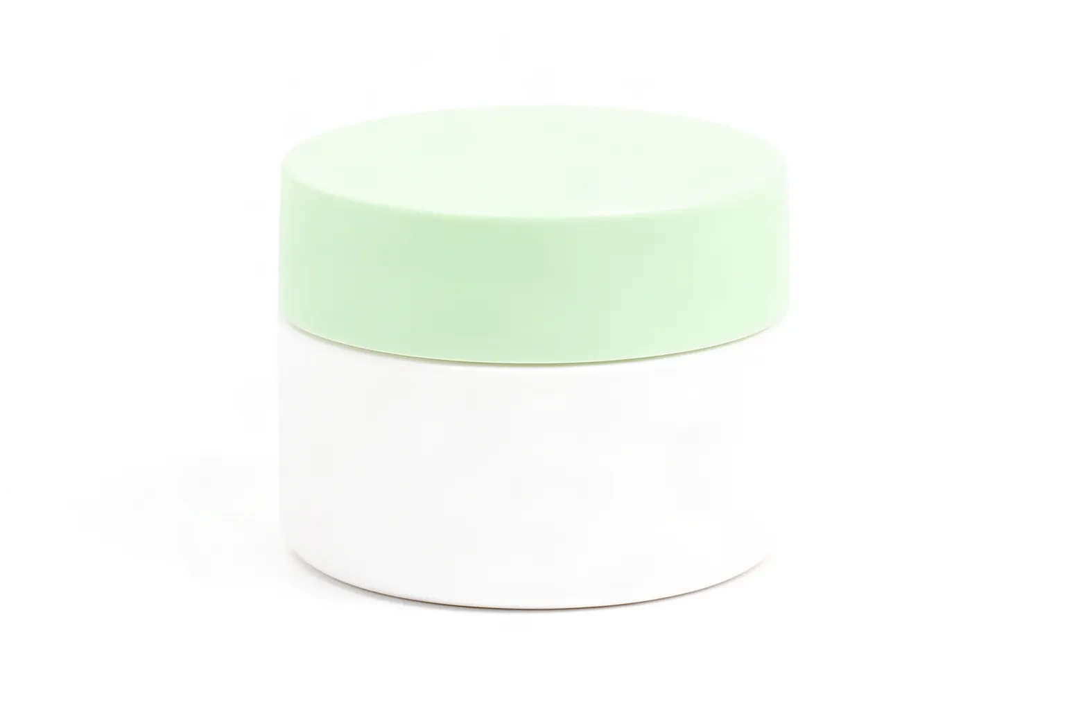 A matte white cosmetic jar with a pale mint-green lid on a white background.